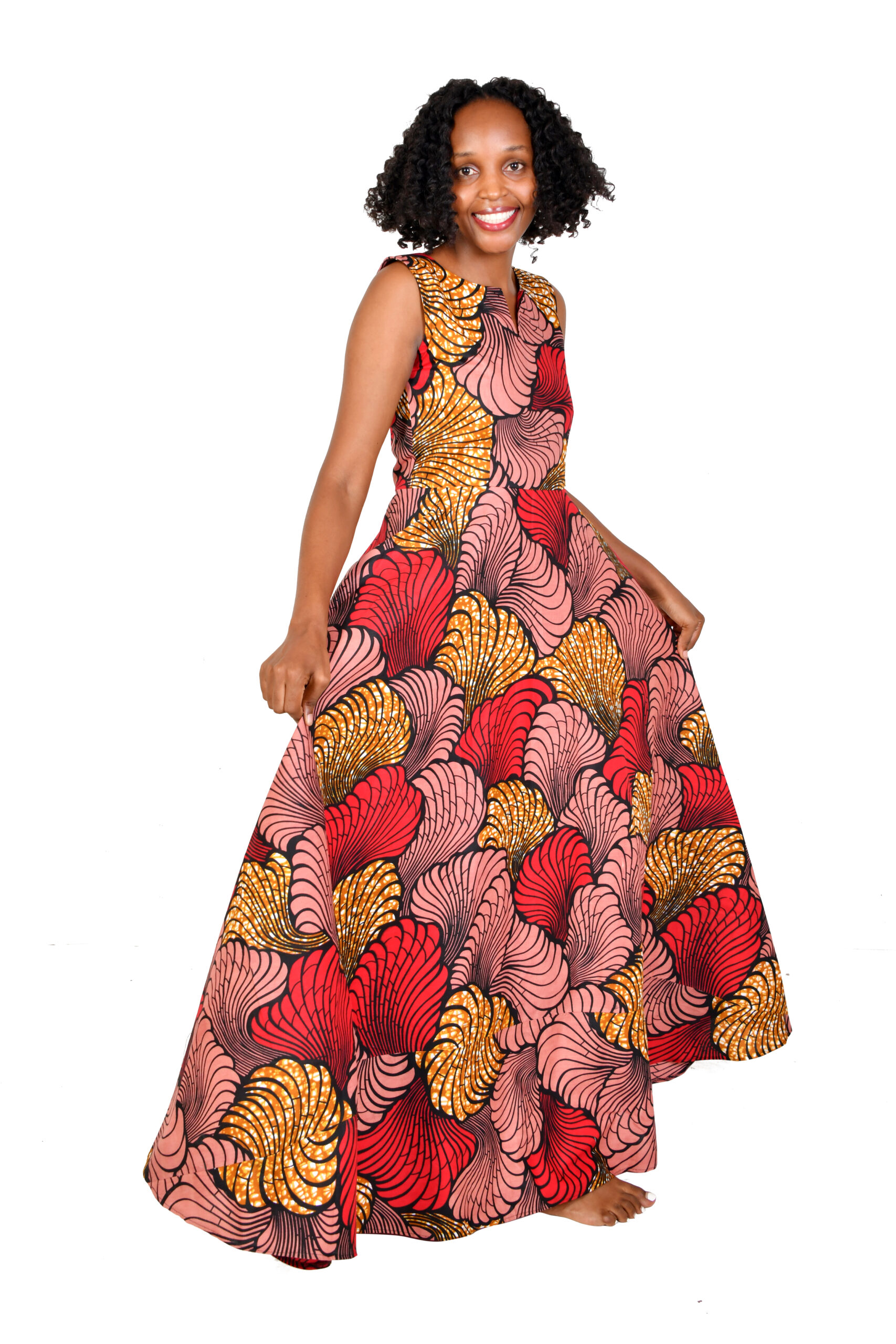 A woman wearing an African Print Maxi Dress with a vibrant pattern, ideal for an engagement party.