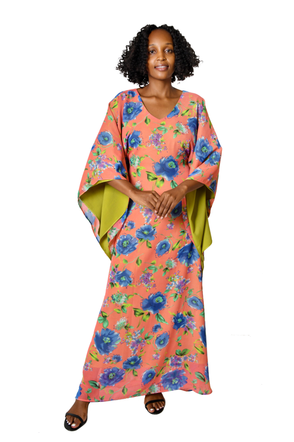 Maxi Robe in Kitenge Full-length with sleeves. Handmade in Tanzania — wear as loungewear, a kimono, or a bold layering piece.